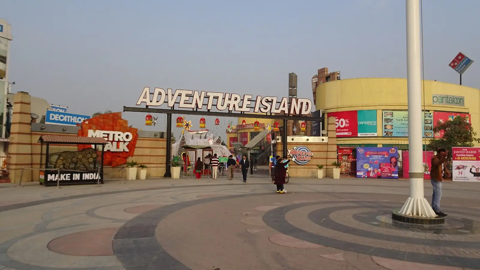 Illustration: entrance plaza of Adventure Island amusement park and Metro Walk mall near Rithala, Rohini.