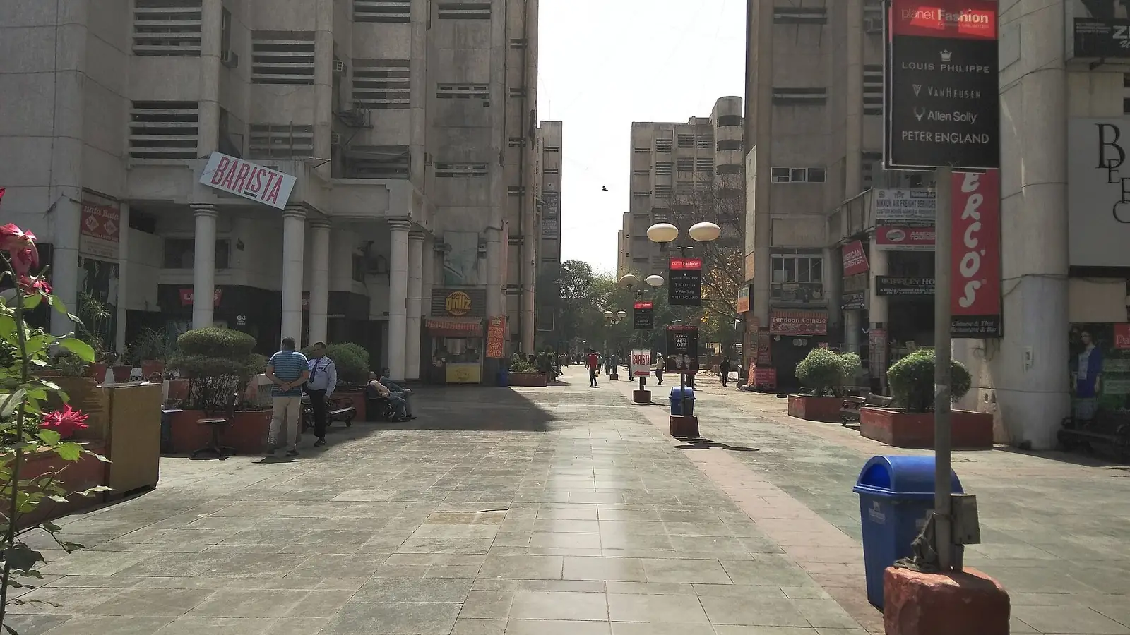 Illustration: pedestrian plaza between office towers and shops at Janakpuri District Centre.