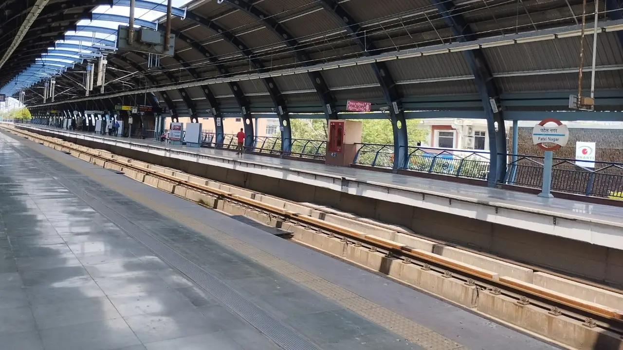 Illustration: elevated platform and canopy of Patel Nagar metro station on the Blue Line.
